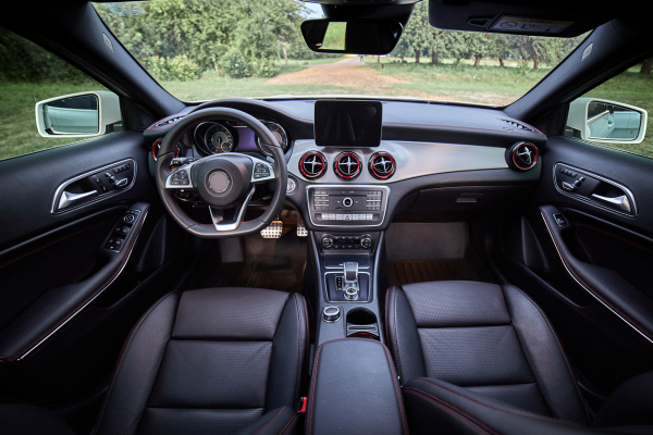 inside of a car showing seats and steering wheel